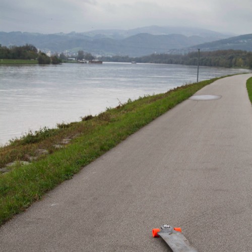three friends longboarding the Danube cycling path