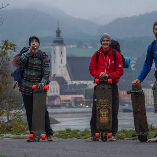 three friends longboarding the Danube cycling path